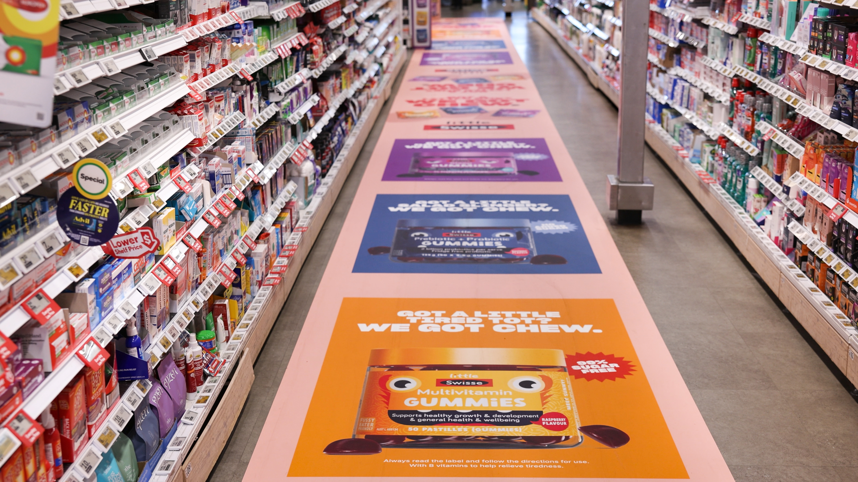 bus stop point of sale advertising in supermarket aisle