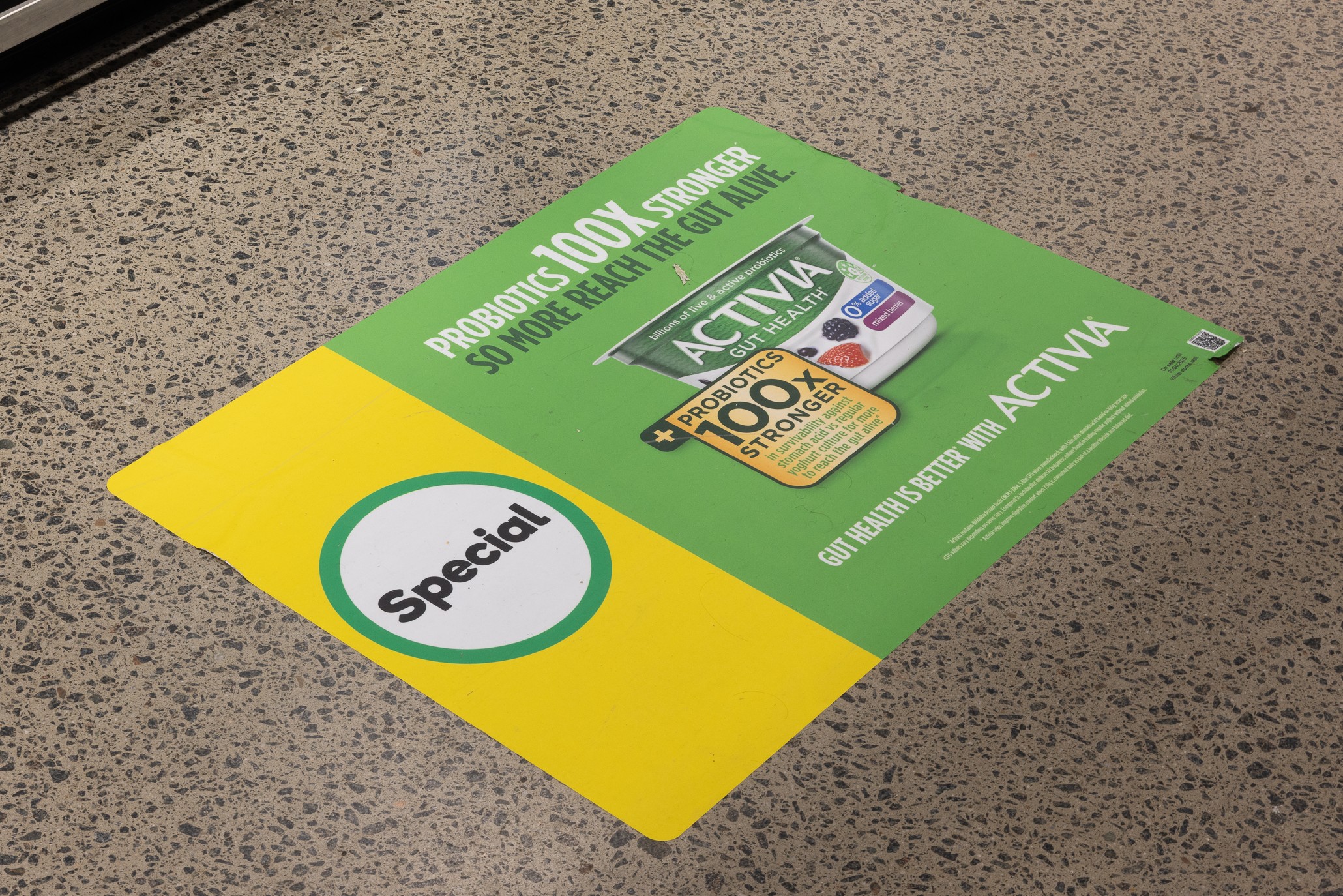 point of sale advertising over a fridge in Woolworths supermarket