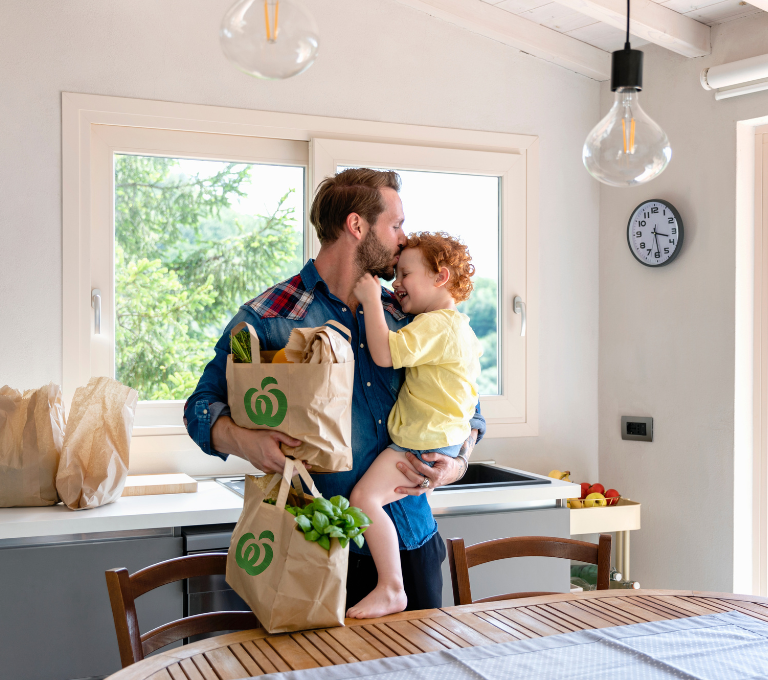 Father and Son with Woolworths bags